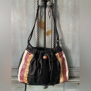 Black leather shoulder bag with white, red and beige snakeskin details